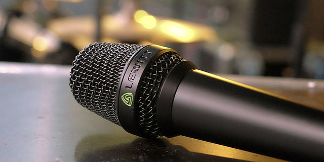 This image shows the MTP 840 DM live performance microphone on stage