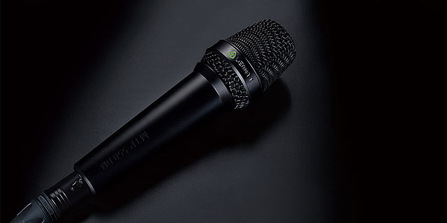 This image shows the MTP 550 DM live performance microphone on black background