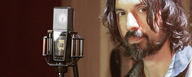 This image shows a sound engineer in studio with his LCT 940 Tube/FET microphone